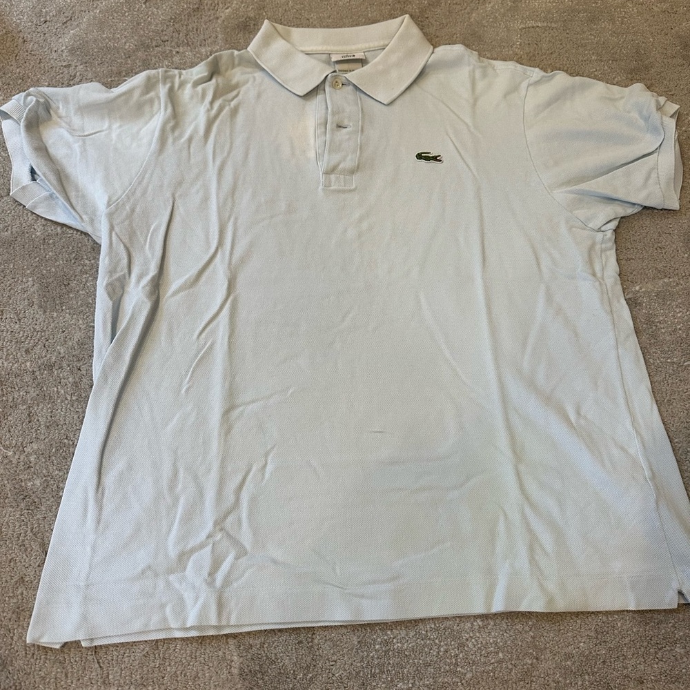 Light blue vintage men’s Lacoste polo.